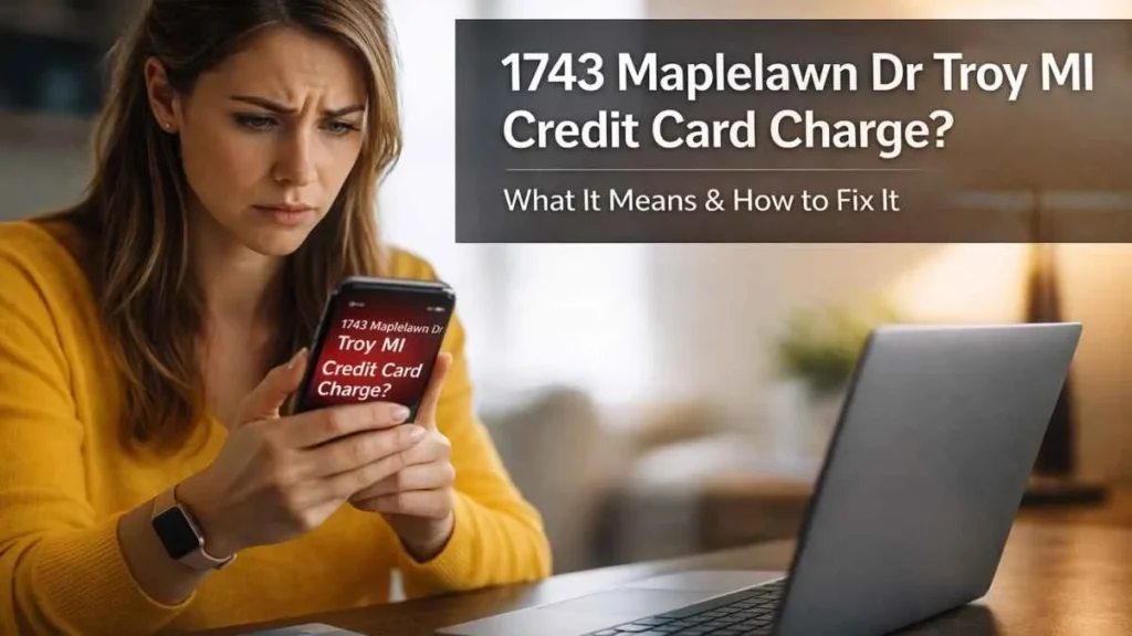 A concerned American woman looking at her phone showing the “1743 Maplelawn Dr Troy MI credit card charge,” with a laptop and credit card on her desk